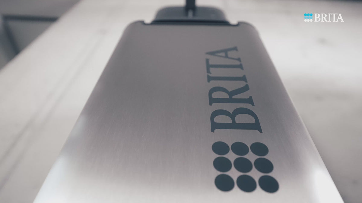 Load video: BRITA Top Compact Still water dispenser in use in an office setting.